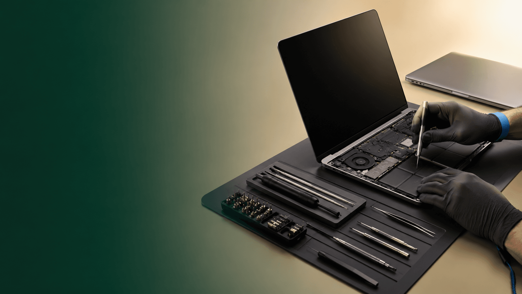 Professional computer and laptop repair service at a workbench